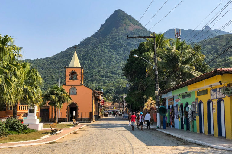 Church and colourful houses of Vila do Abraão, the start of the trail