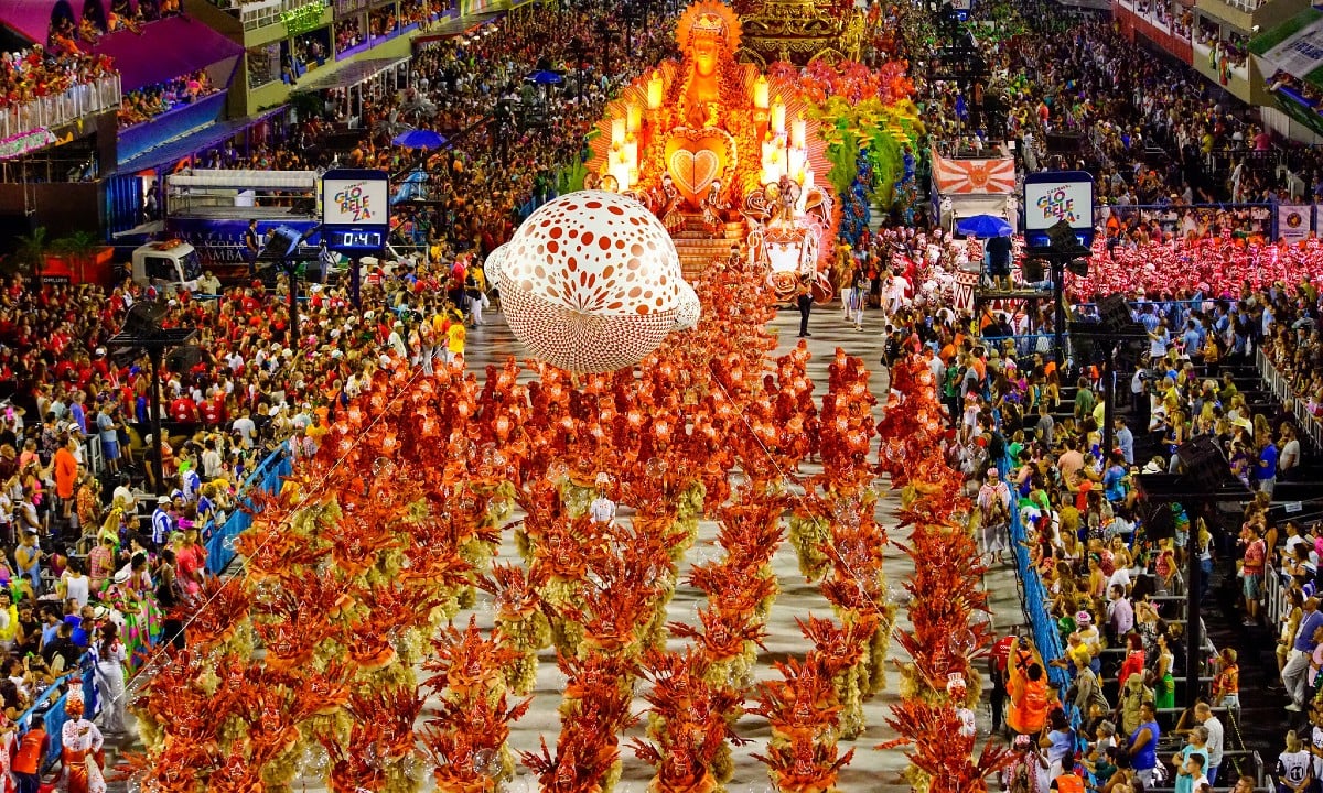 Samba school parade with hundreds of costumed dancers in the Sambadrome