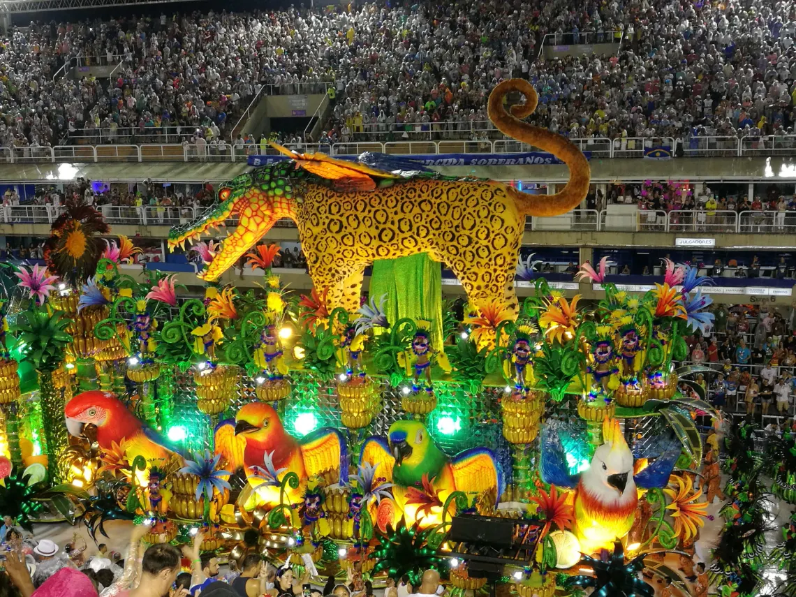 Illuminated parade float with a giant jaguar during a Brazilian festival