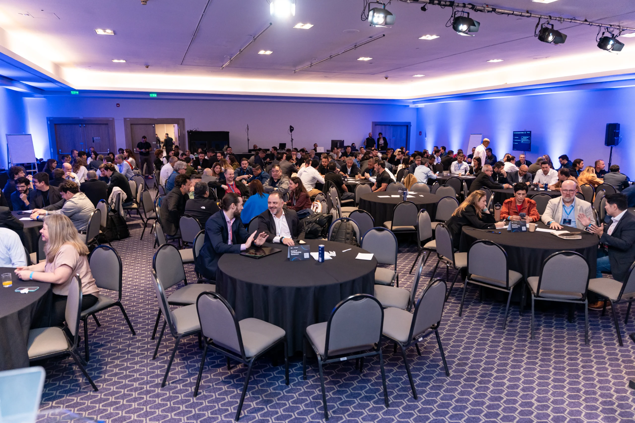 Conference stage and audience at an event in Brazil